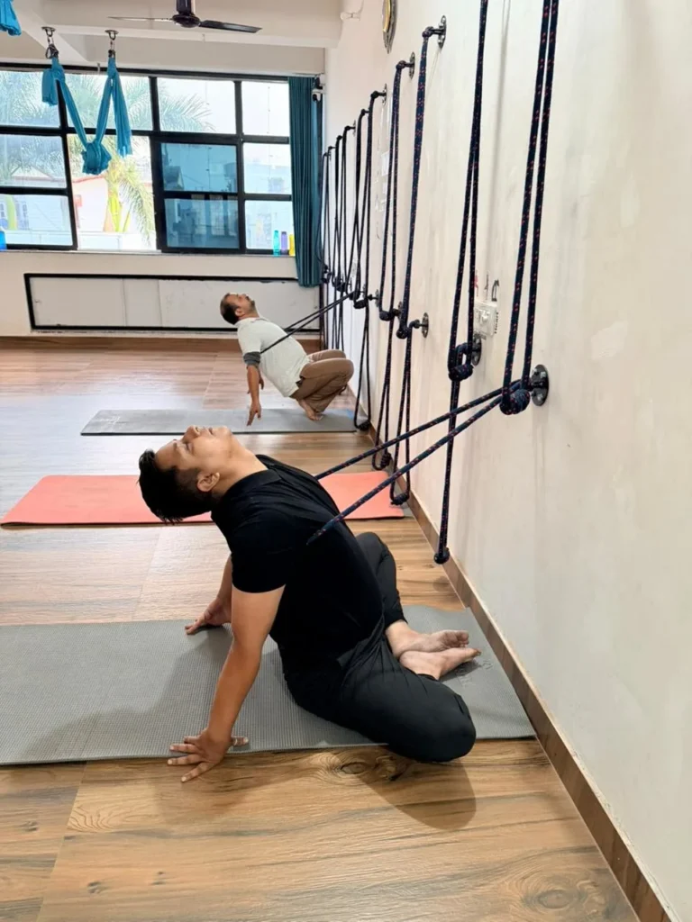 Yoga Student Performing Rope-Supported Backbend