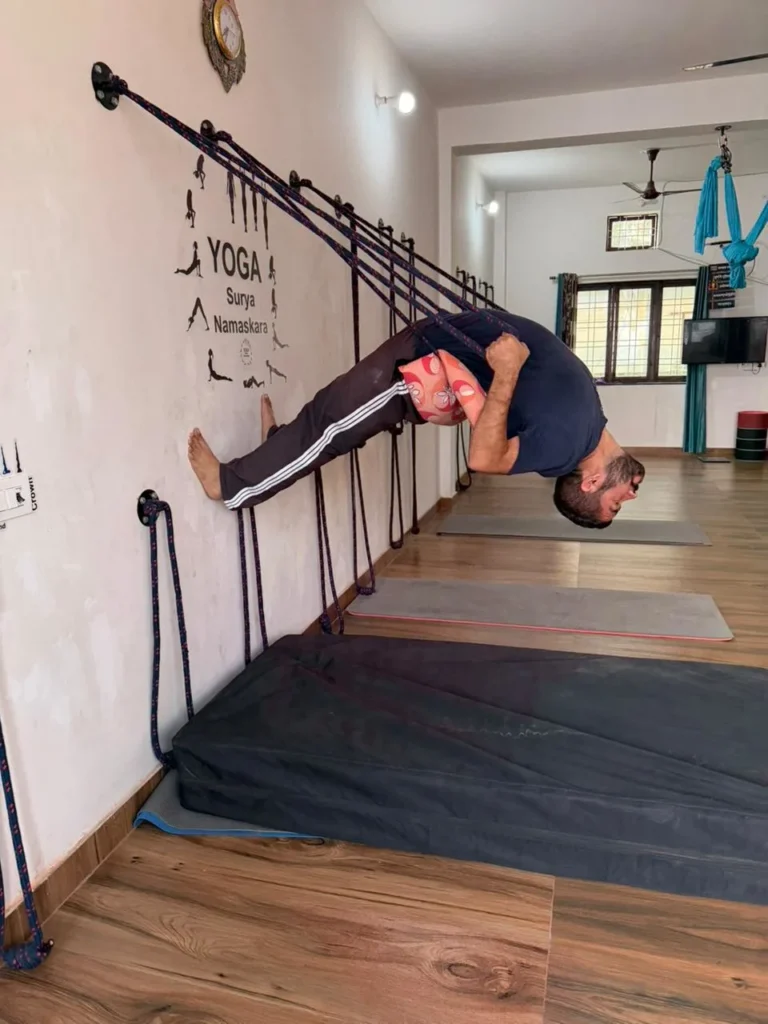 Yoga Student Practicing Rope Wall Asana