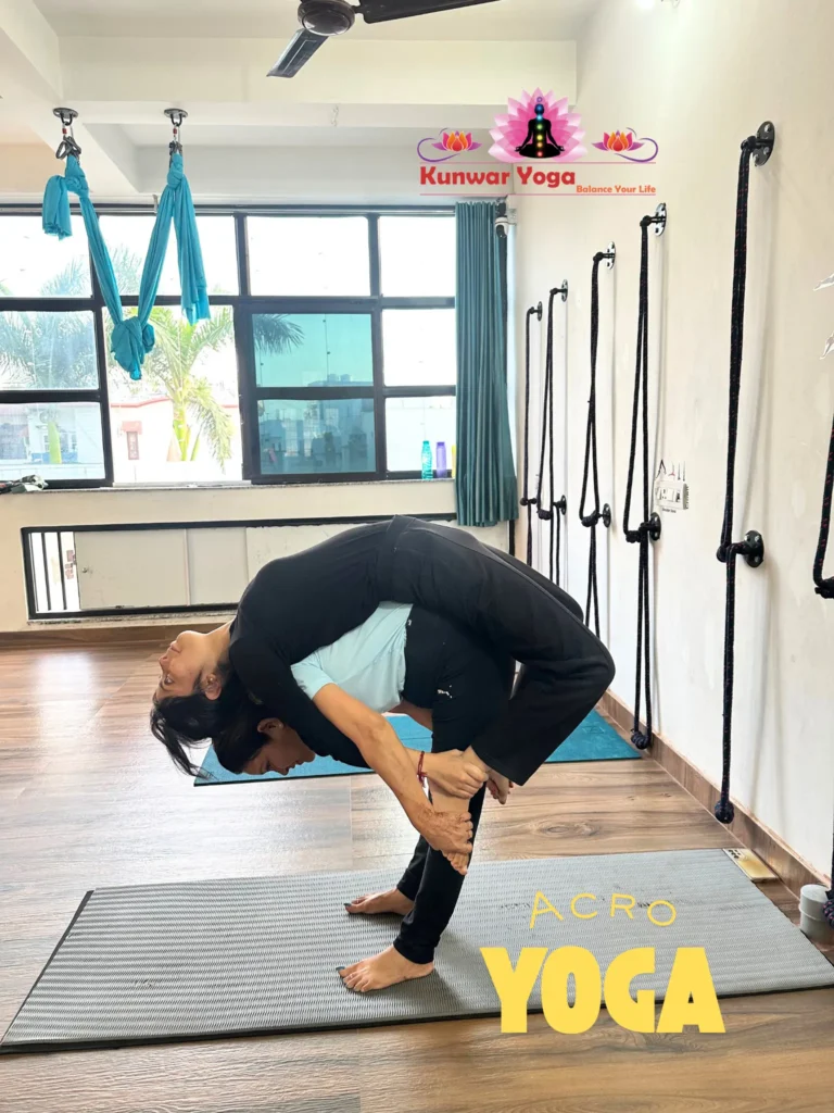 Acro Yoga students practicing partner balance pose at Kunwar Yoga Dehradun